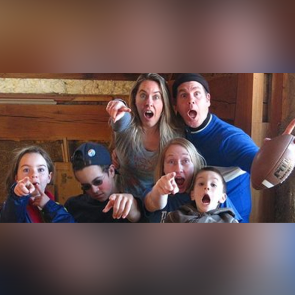 A family of six making goofy faces at the camera A family of six making goofy faces at the camera