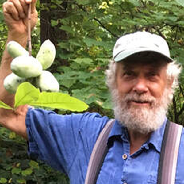 Garden at Dogwood farmer holding up produce Garden at Dogwood farmer holding up produce